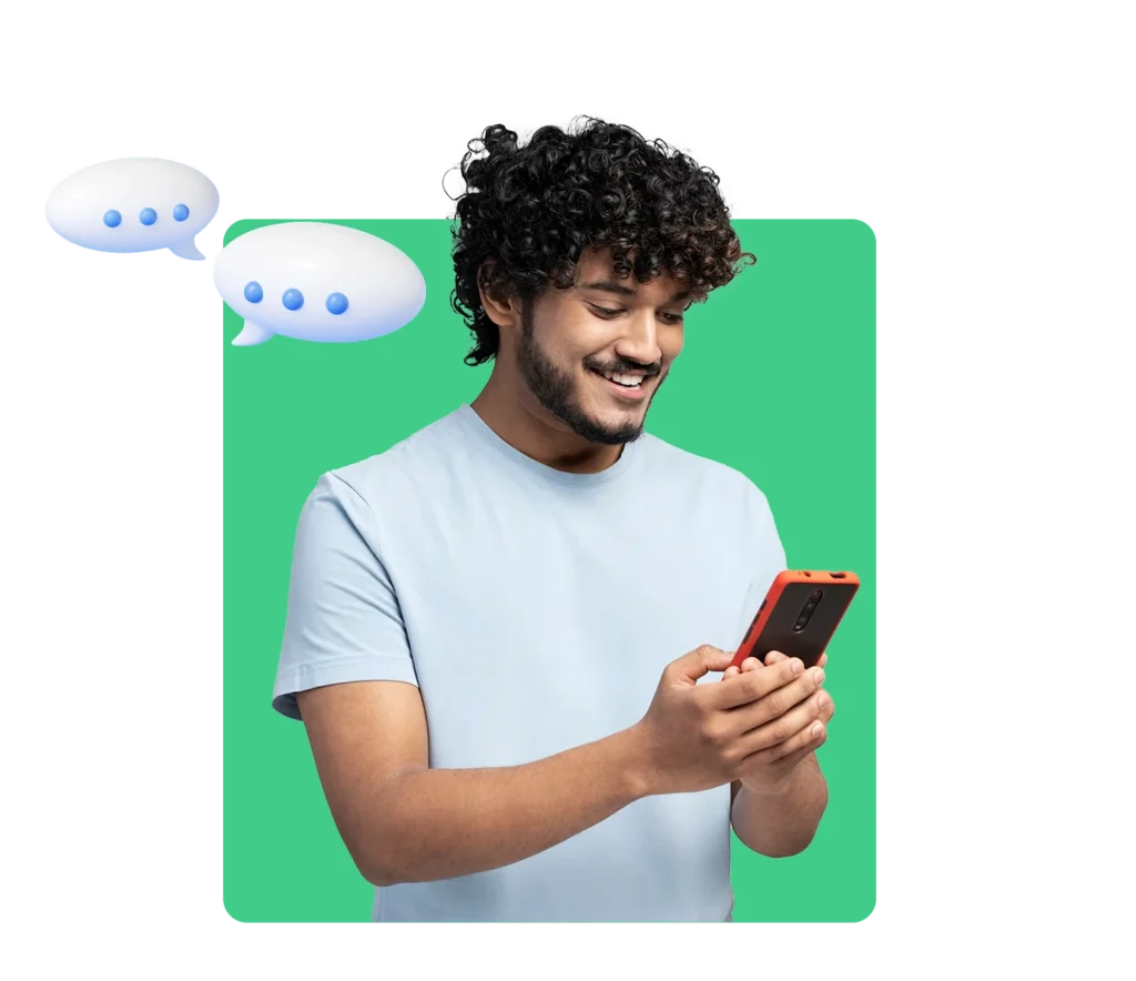 Smiling man reading text messages on smartphone with chat bubbles, representing customer engagement through text messaging.