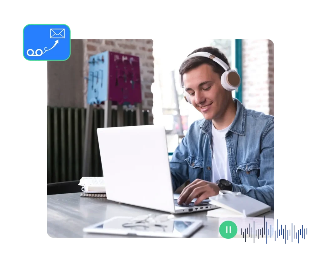 Professional using a laptop and headphones to manage voicemail settings, showcasing productivity tools and communication setup.