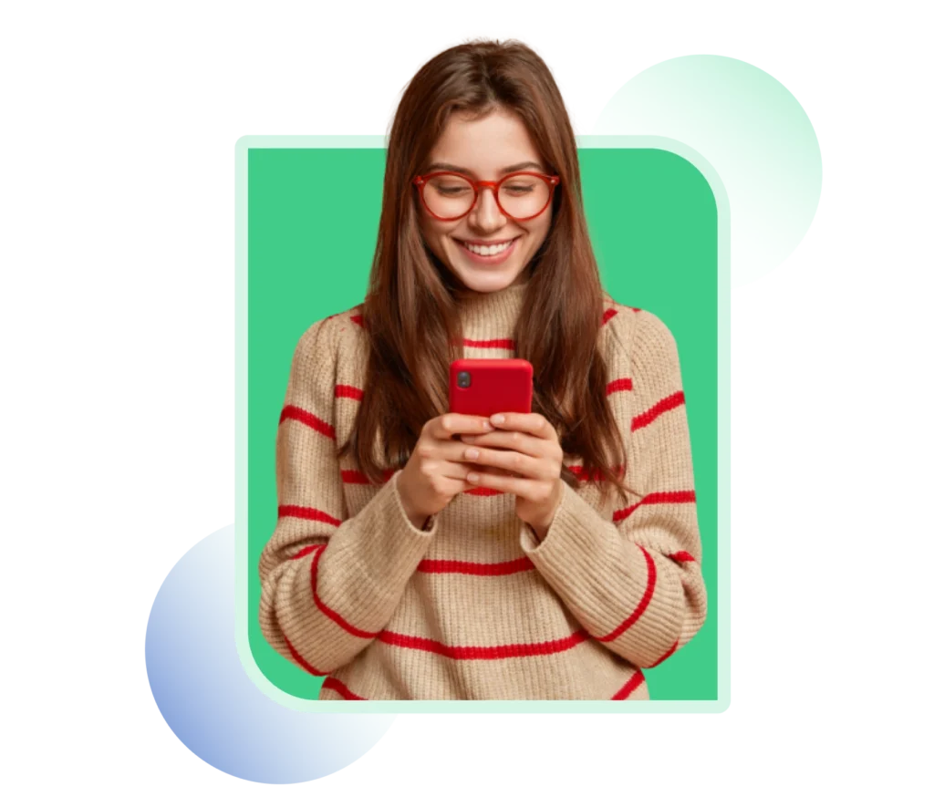Smiling woman reading a message on her phone, representing bulk SMS marketing for customer engagement and brand promotion.